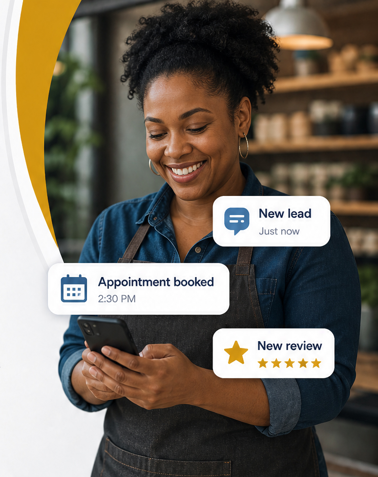 Small business owner smiling while using her smartphone